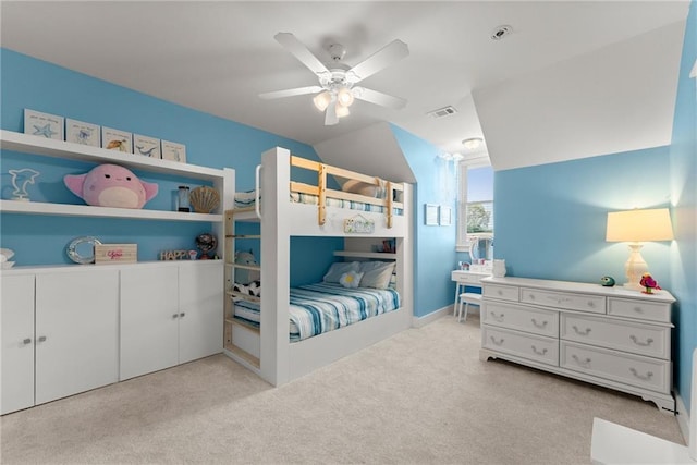 bedroom featuring visible vents, a ceiling fan, carpet flooring, and vaulted ceiling