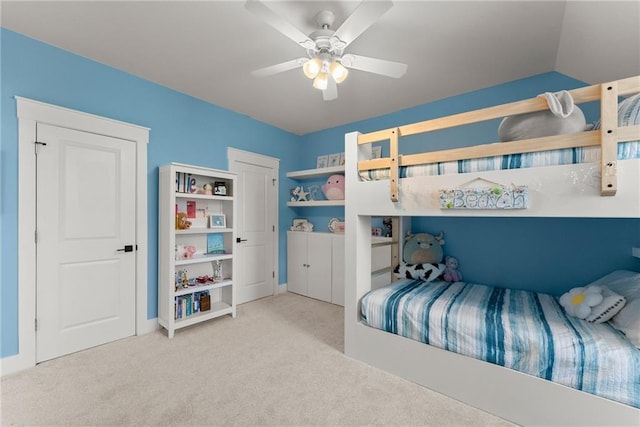 carpeted bedroom featuring ceiling fan
