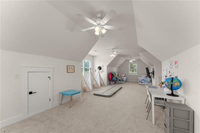 playroom with vaulted ceiling, carpet floors, a ceiling fan, and baseboards