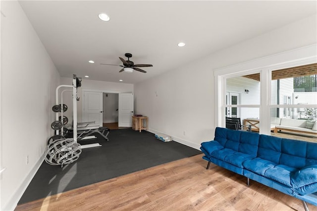 exercise room featuring wood finished floors, baseboards, recessed lighting, and ceiling fan
