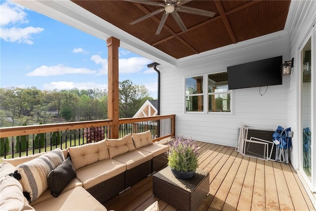 wooden deck featuring a ceiling fan and an outdoor hangout area