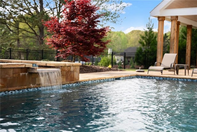 view of pool with a fenced backyard and a fenced in pool