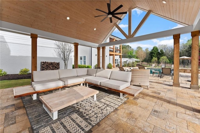 view of patio / terrace with a gazebo, an outdoor hangout area, and a ceiling fan