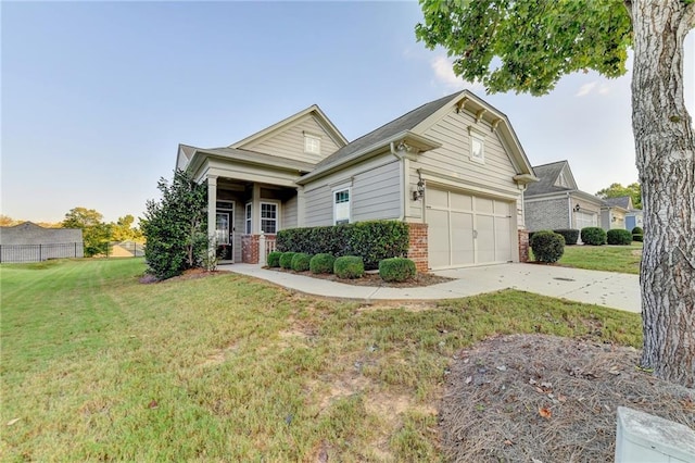 view of front of property with a front yard and a garage