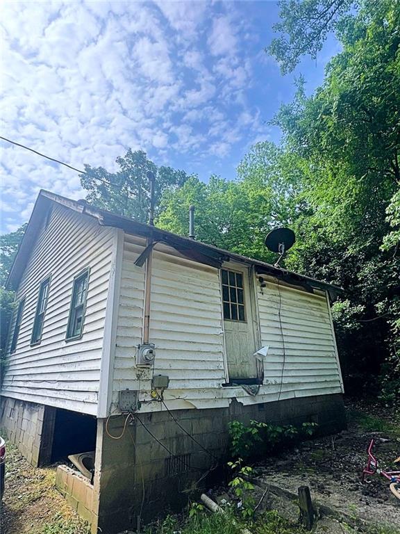 view of property exterior with crawl space