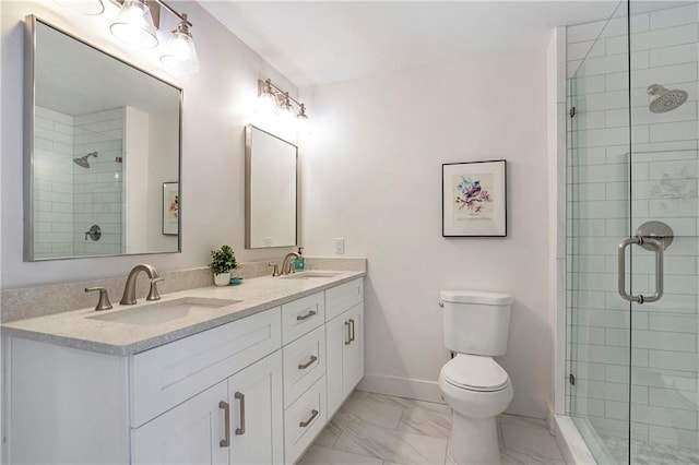 bathroom with toilet, an enclosed shower, and vanity