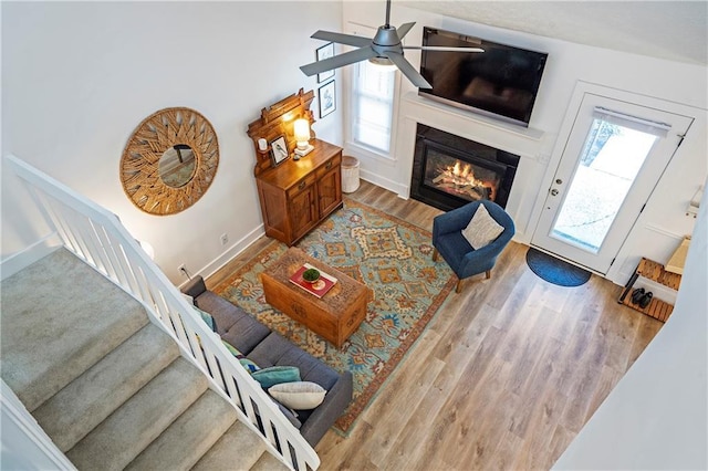 living room with ceiling fan and wood-type flooring