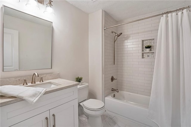 full bathroom featuring a textured ceiling, shower / tub combo with curtain, vanity, and toilet