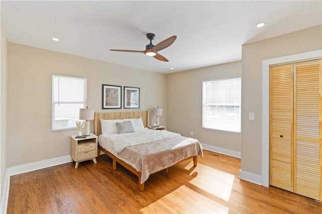 bedroom featuring hardwood / wood-style floors and ceiling fan