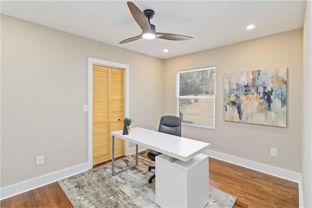 office area featuring wood-type flooring and ceiling fan