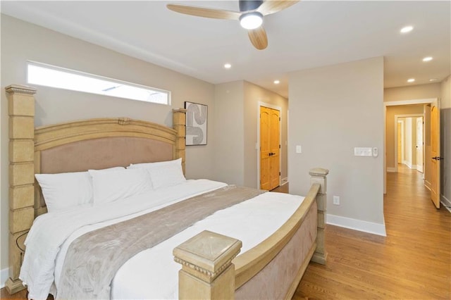 bedroom with ceiling fan and light wood-type flooring