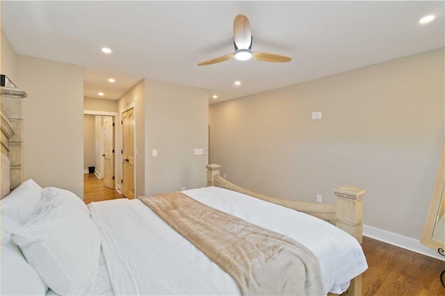 bedroom with ceiling fan and wood-type flooring