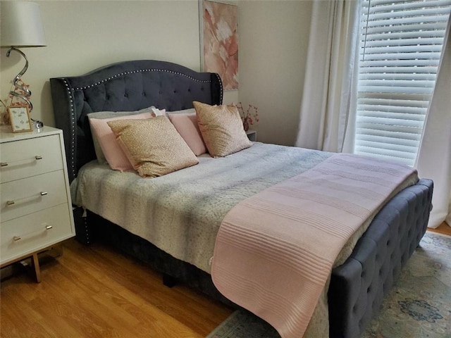 bedroom featuring wood finished floors