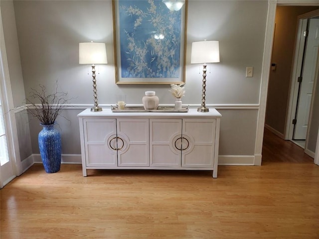 bathroom featuring baseboards and wood finished floors