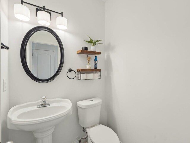 bathroom featuring a sink and toilet