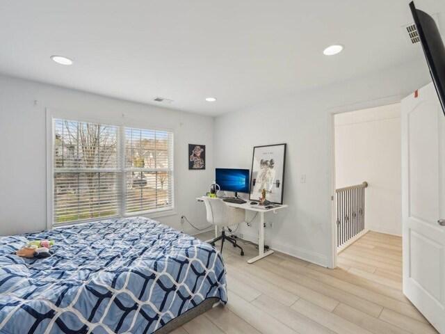 bedroom featuring recessed lighting, wood finished floors, visible vents, and baseboards