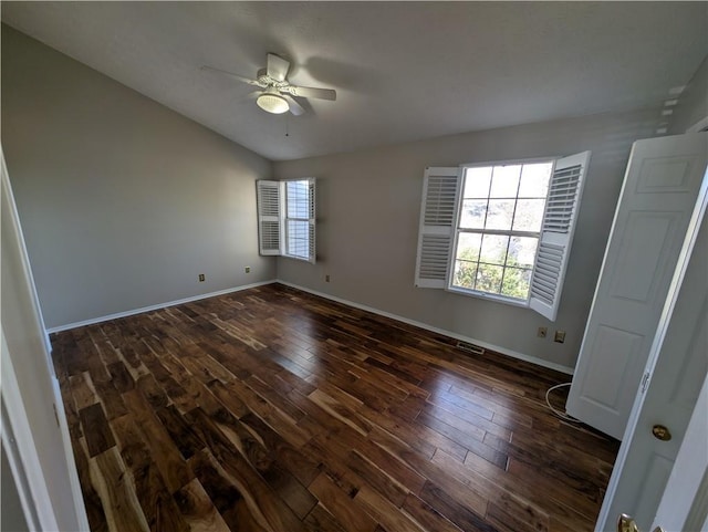 unfurnished bedroom with dark hardwood / wood-style flooring and ceiling fan