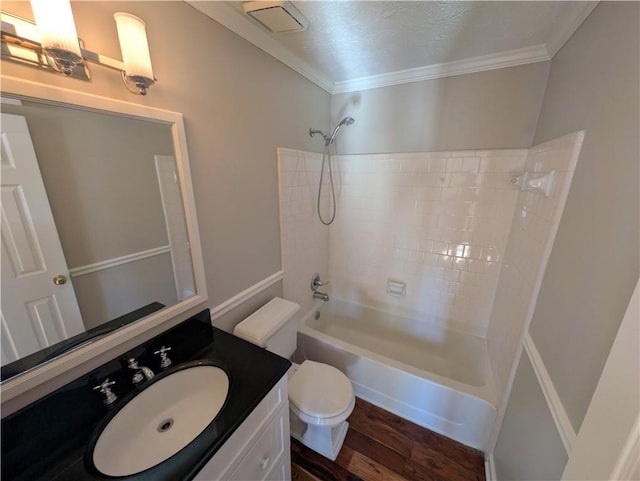 full bathroom featuring crown molding,  shower combination, toilet, and hardwood / wood-style flooring