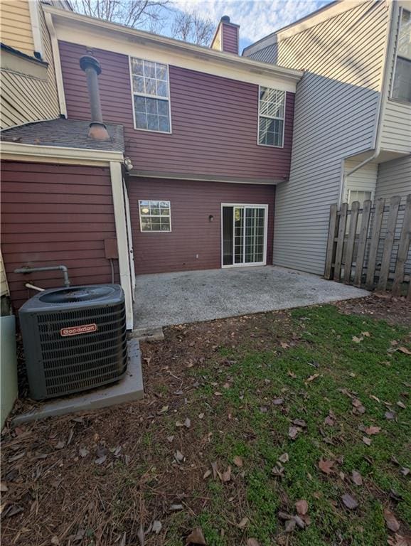 rear view of property featuring cooling unit and a patio