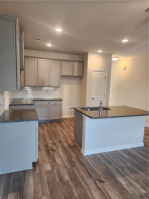 2822 Saratoga Lake Vw, Decatur, GA 30034 - kitchen featuring dark hardwood / wood-style floors, sink, an island with sink, and tasteful backsplash