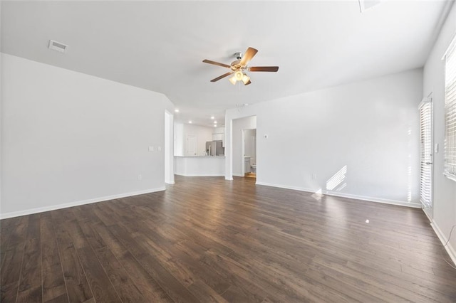 unfurnished living room with ceiling fan and dark hardwood / wood-style floors