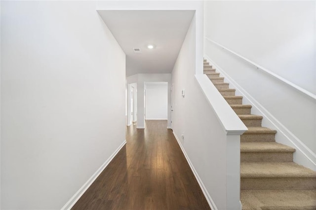 stairs with wood-type flooring