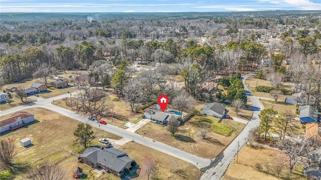 aerial view of property's location with nearby suburban area