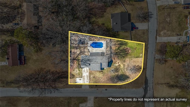 aerial view of property's location with property parcel outlined and a pool area