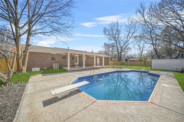 view of pool with cooling unit, a patio area, a fenced backyard, and an outdoor structure