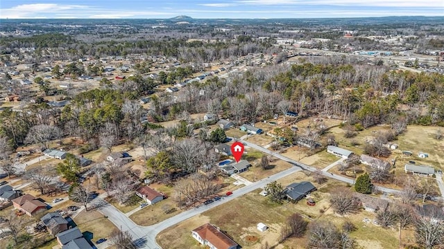 aerial overview of property's location with nearby suburban area