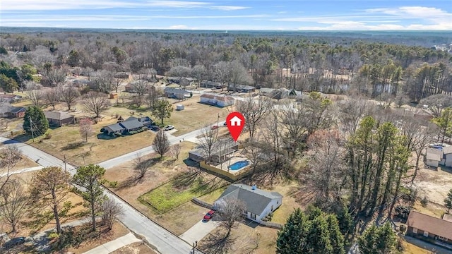 aerial overview of property's location featuring a forest