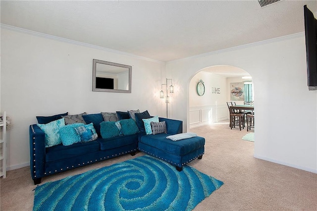 living room featuring crown molding and carpet floors