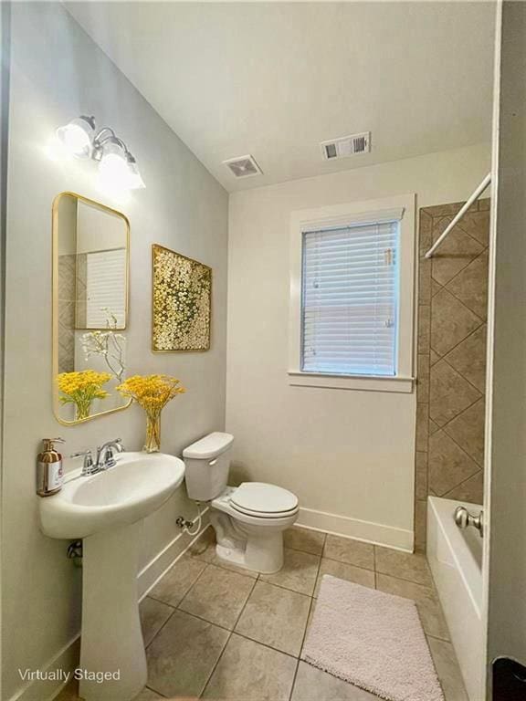 1147 Halletts Peak Pl, Lawrenceville, GA 30044 - full bathroom featuring tile patterned floors, toilet, baseboards, and tub / shower combination