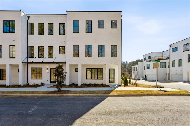 townhome / multi-family property with stucco siding