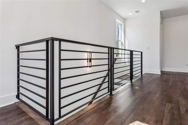 staircase featuring visible vents, recessed lighting, wood finished floors, and baseboards