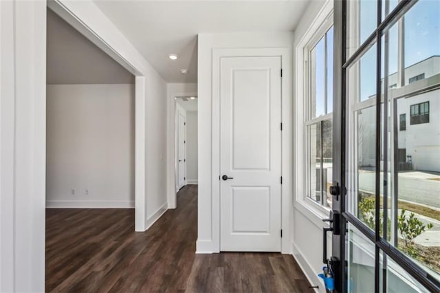 entryway featuring french doors, baseboards, and dark wood-style floors