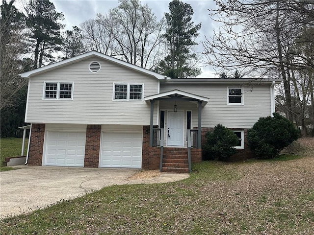 3967 Evelyn Dr, Powder Springs, GA 30127 - split foyer home featuring driveway, brick siding, and an attached garage