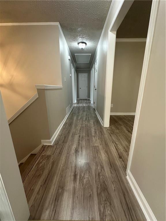 3967 Evelyn Dr, Powder Springs, GA 30127 - hallway featuring ornamental molding, wood finished floors, baseboards, and a textured ceiling