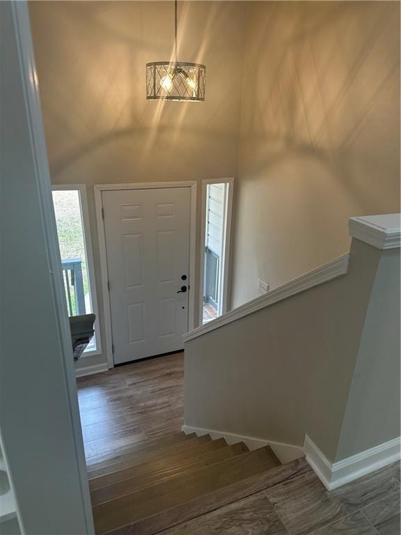 3967 Evelyn Dr, Powder Springs, GA 30127 - foyer featuring a high ceiling, stairs, baseboards, and wood finished floors