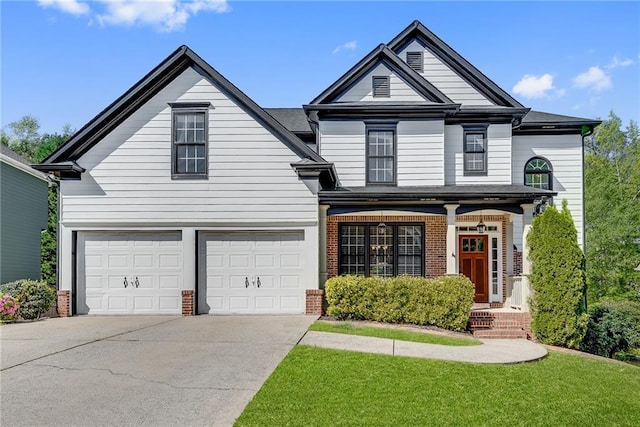 3085 Woodbridge Ln, Canton, GA 30114 - traditional home featuring brick siding, concrete driveway, a garage, a front lawn, and covered porch
