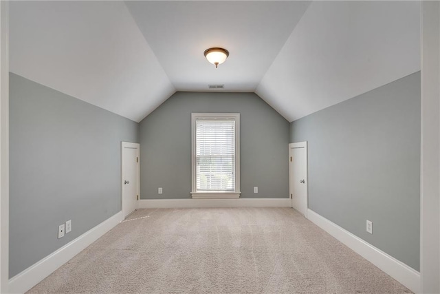 3085 Woodbridge Ln, Canton, GA 30114 - additional living space featuring lofted ceiling, light carpet, and baseboards