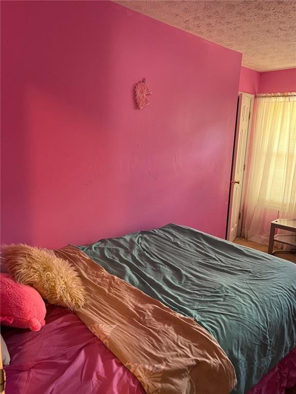 bedroom with a textured ceiling