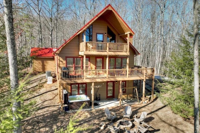 back of house featuring a patio and a deck