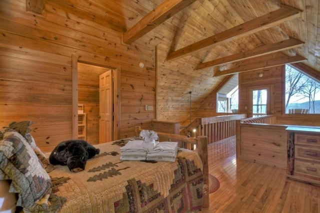 bedroom with vaulted ceiling with beams, wooden walls, wooden ceiling, and wood-type flooring