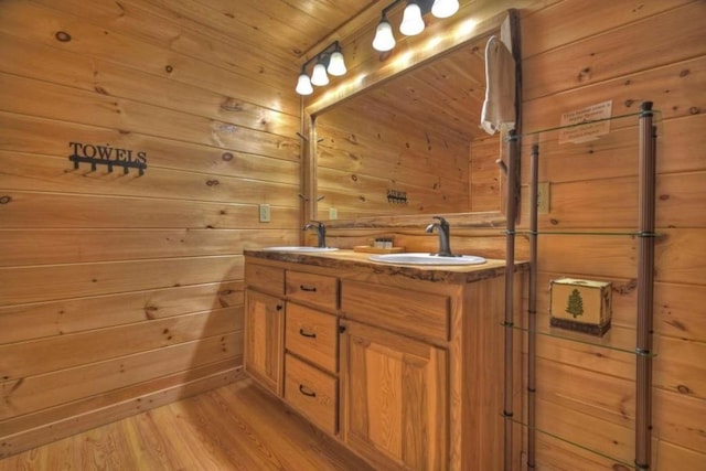 bathroom with wood ceiling, wood walls, hardwood / wood-style floors, and vanity