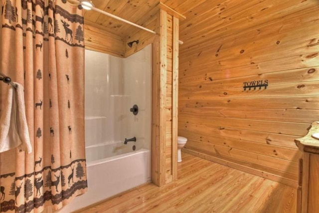 full bathroom featuring toilet, wooden walls, wooden ceiling, hardwood / wood-style flooring, and shower / tub combo with curtain