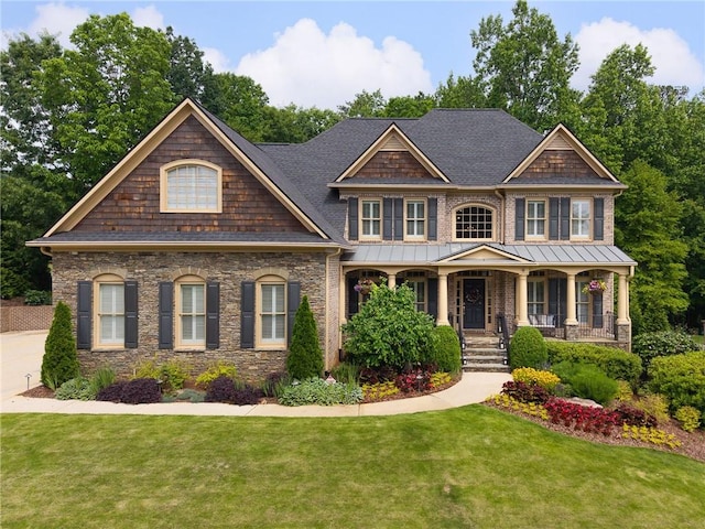 1235 Grand View Dr SE, Smyrna, GA 30126 - view of front of home featuring a front lawn, covered porch, a shingled roof, and stone siding