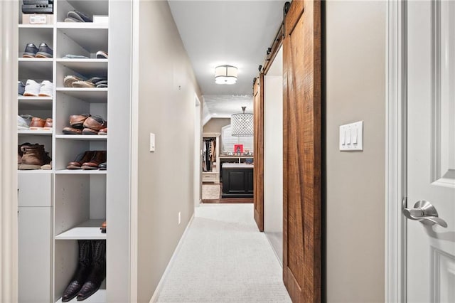 1235 Grand View Dr SE, Smyrna, GA 30126 - hall featuring a barn door, carpet flooring, and baseboards