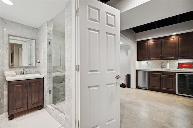 1235 Grand View Dr SE, Smyrna, GA 30126 - indoor wet bar featuring beverage cooler, refrigerator, tasteful backsplash, and finished concrete flooring