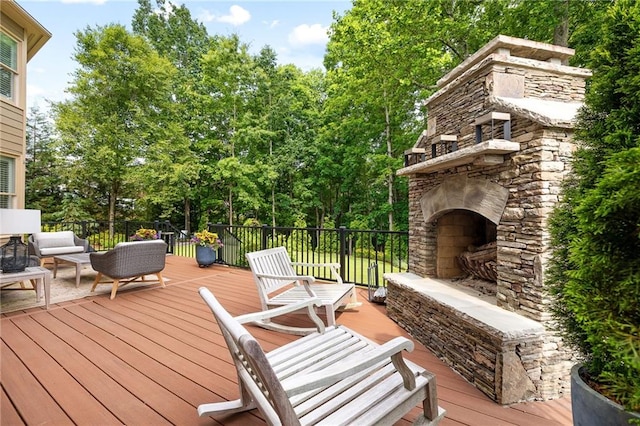 1235 Grand View Dr SE, Smyrna, GA 30126 - wooden deck with an outdoor living space with a fireplace and view of wooded area